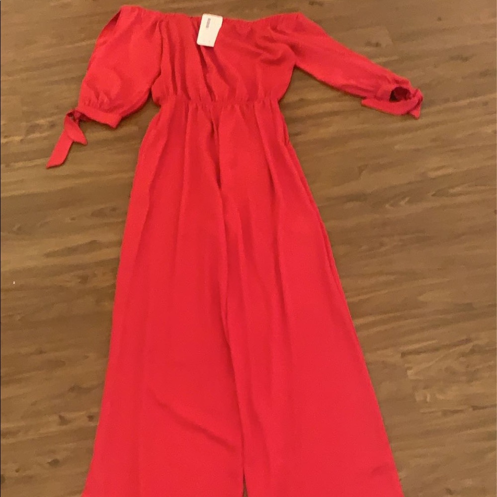Size medium, pant romper. Never worn